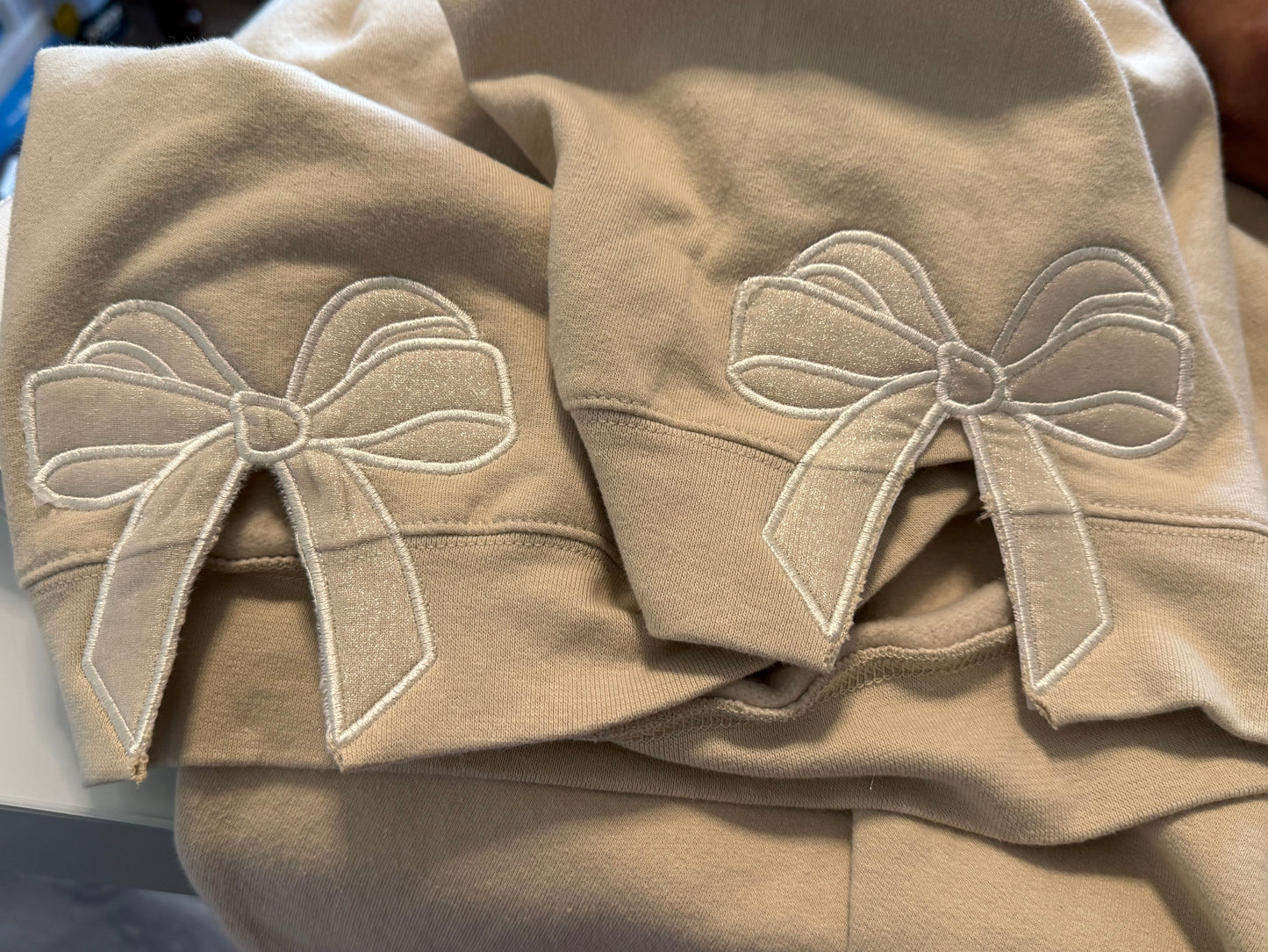 Long sleeve customized embroidered crewneck sweatshirt with monogram and bows on the sides